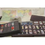 Stamps World selection and cigarette cards in large box.