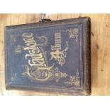 The Gladstone Album - illustrated leather bound, with original key and working musical movement