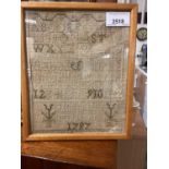 A small sampler dated 1797, and a large antique embroidery of flowers (2)