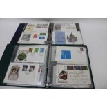 Box of stamps in packets and albums of FDCs