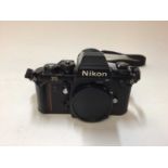 Nikon F3 HP 35mm SLR camera body with strap and lens cap