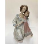 Three Lladro porcelain figures - mother and daughter 5449, girl with basket of flowers 5416 and boy