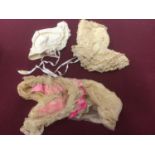 Four Victorian baby bonnets including a lace and pink ribbond half hat, an embroidered wool, satin r