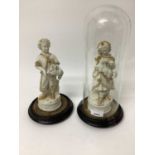 A pair of Victorian bisque figures on bases, one under an antique glass dome, 13" high including dom