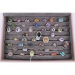 Collection of 43 silver gem set dress rings displayed in a ring tray