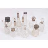 Group of silver mounted cut glass scent bottles