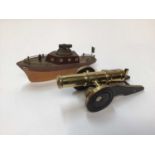 Novelty lighter in the form of a cannon and another in the form of a boat (2)