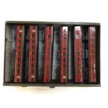 Railway OO gauge selection of Exley tinplate carriages housed in metal cabinet various lines includi