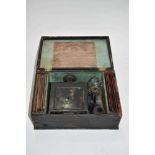 Antique German magic lantern in case with slides - original trade label to inside of case