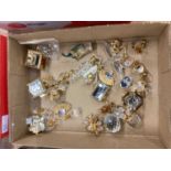 Collection of unboxed Swarovski crystal and gold coloured miniature items including buildings, rocki