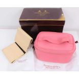 Penhaligon's pink leather travel vanity case and cream leather travel jewellery wallet, both in dust