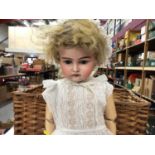 Large antique bisque headed doll marked 19 2 and 17 on the neck, in christening gown