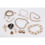 Group of 9ct gold jewellery including broken chains, heart link bracelet, pendants and bow brooch