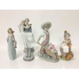 Four Lladro porcelain figures including married couple, and girl with oranges