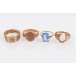 Four 9ct gold rings to include two signet rings, horseshoe ring and vintage blue stone ring