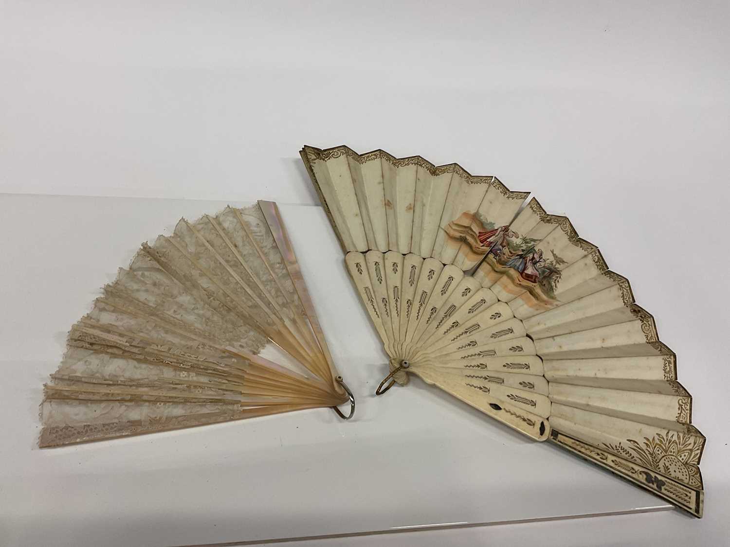 19th century carved bone fan and a mother of pearl fan