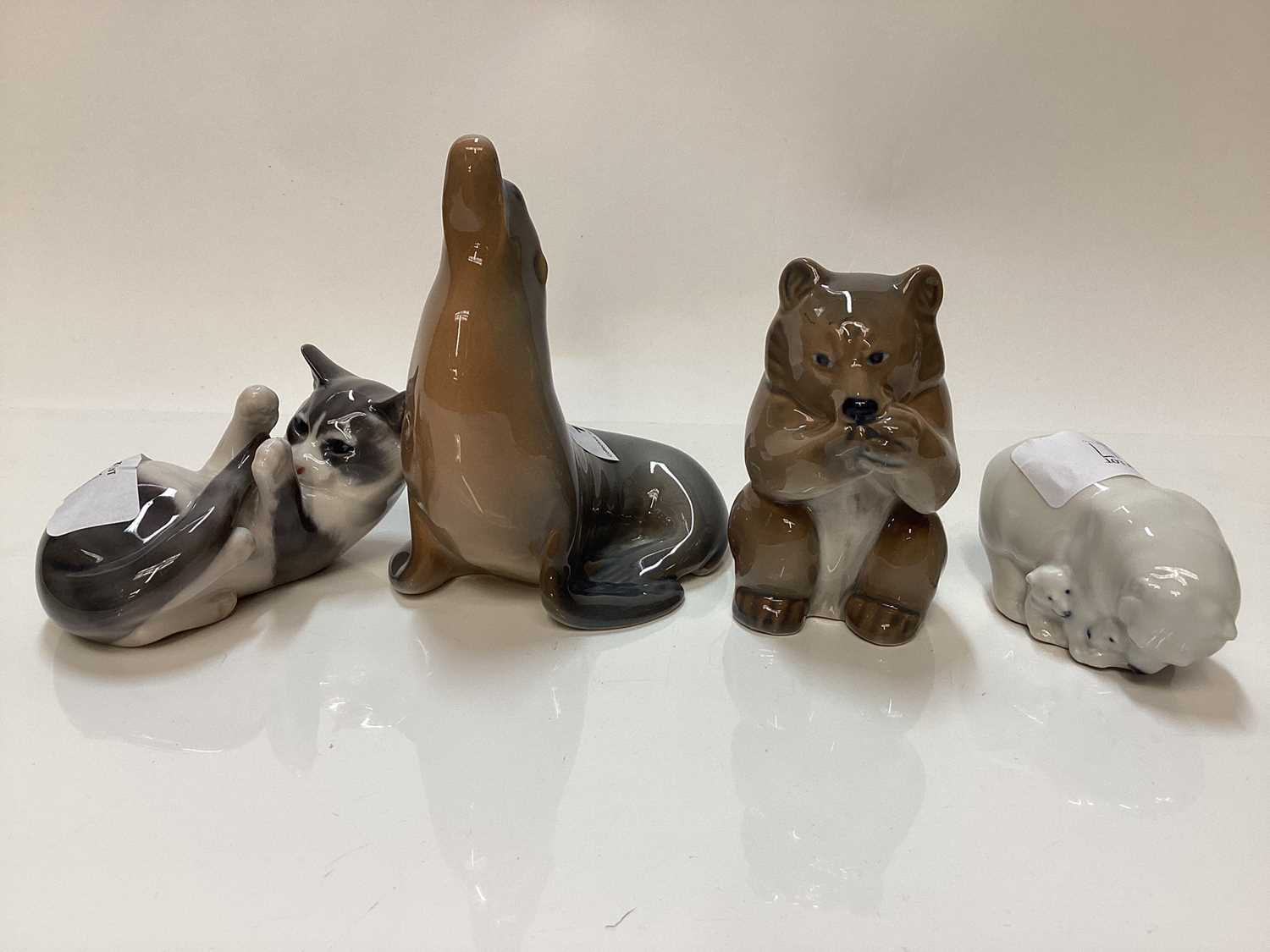 Four Royal Copenhagen porcelain models - Bear number 3014, Kitten number 727, Polar Bear group numbe