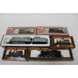 Railway mainline OO gauge three boxed locomotives plus two boxed Lima locomotives (no tenders) and a