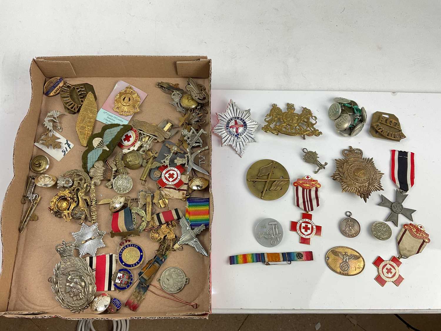 Collection of military badges and buttons to include Nazi 1st May 1936, National Labour Day badge, N