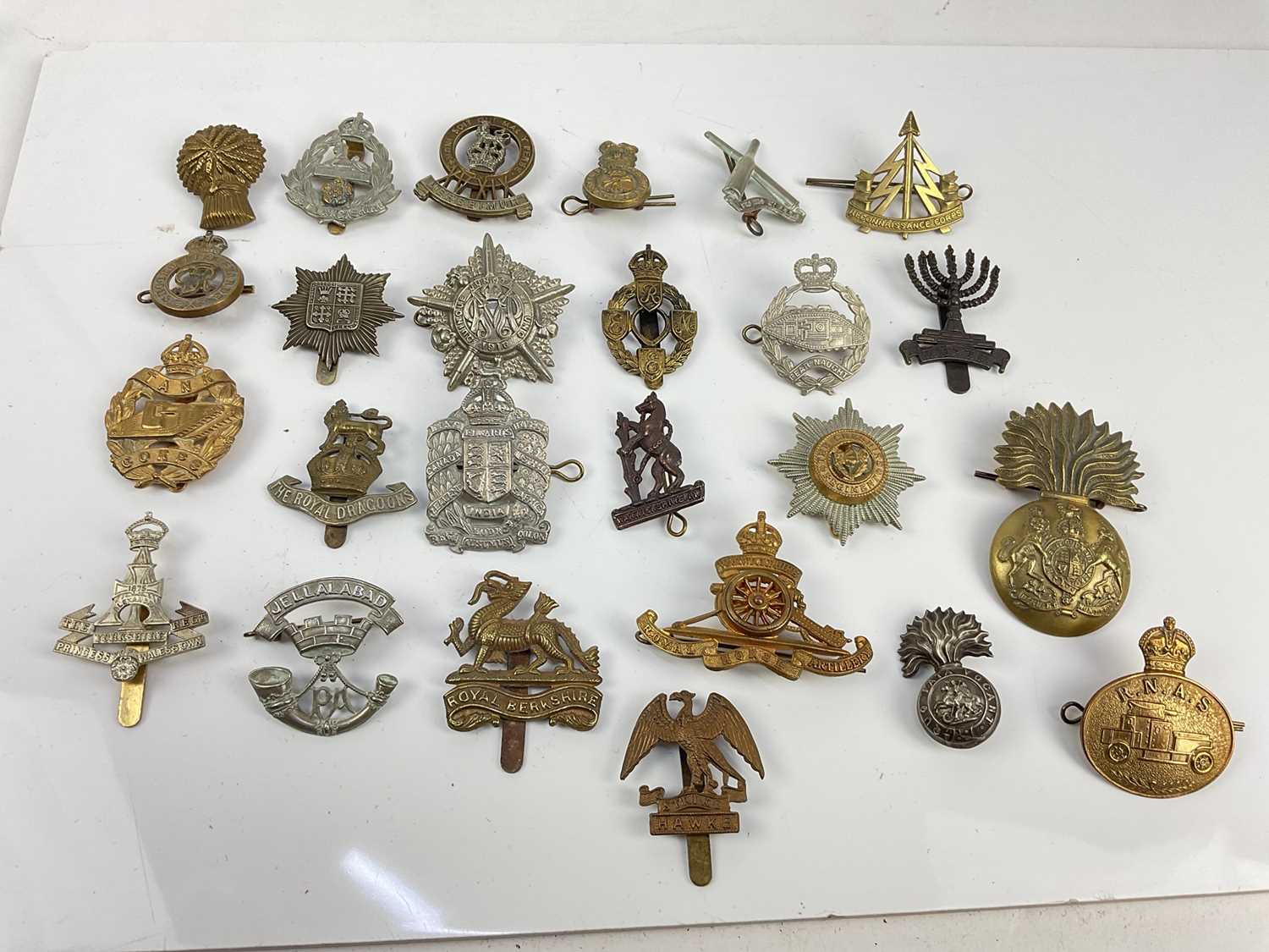 Collection of twenty five British military cap badges to include Tank Corps, Second Life Guards and