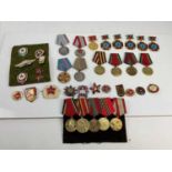 Large group of Cold War era Soviet commemorative medals and decorations.
