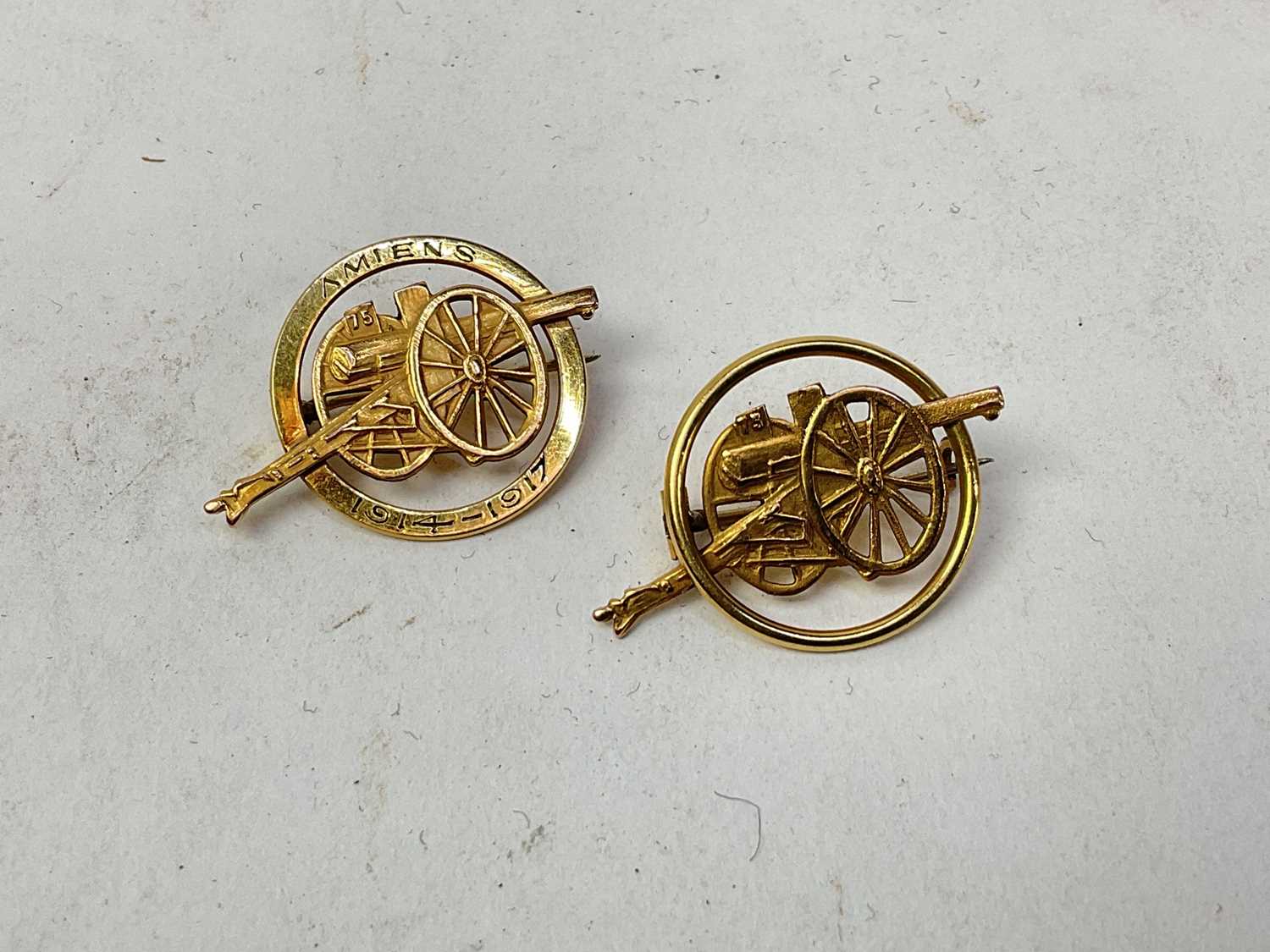Two First World War French yellow metal sweetheart brooches in the form of gun carriages, one marked