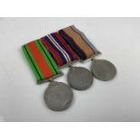 Second World War Australian medal trio comprising Defence and War medals together with Australia Ser