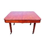 Good mahogany extending dining table, the rounded rectangular top with geometric deep frieze raised