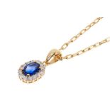 Blue sapphire and diamond cluster pendant in 18ct gold setting on 9ct gold chain