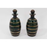 A pair of early 19th century Bristol green glass ovoid-shaped decanters, decorated in gilt and label