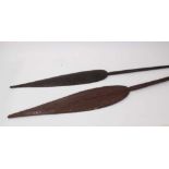 Two antique tribal paddle clubs