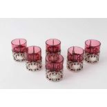 Set six Edwardian silver mounted ruby glass beakers with rococo and cherub decoration, (Chester 1906