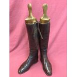 Pair of brown leather hunting boots with wooden trees by Maxwell of London