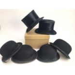 Four vintage black hunting bowler hats, Herbert Johnson, Patey and others, together with two silk to