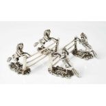 Pair unusual equestrian cast silver knife rests each with twin rearing horses