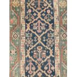 Antique West Persian runner, with angular knot work on midnight blue ground, in main meander border,