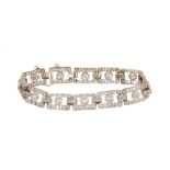 Art Deco style diamond bracelet articulated rectangular openwork panels, each with a round brilliant