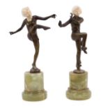 Pair of Art Deco patinated bronze and carved ivory figures of female dancers