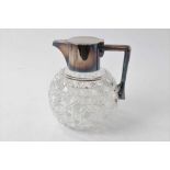 Edwardian cut glass and silver plated claret jug of globular shape