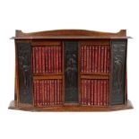 Art Nouveau oak bookcase containing complete Shakespeare