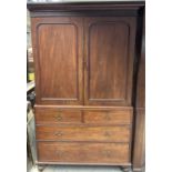 Victorian mahogany linen press, with moulded cornice and fitted interior of slides enclosed by pair