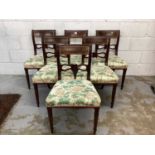 A composite set of ten Regency mahogany dining chairs with rail backs and shaped or spiral bars, uph
