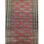 Pakistani Bokhara rug and a pair of Indo Persian rugs (3)