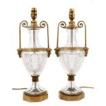 Pair of good quality cut glass and brass mounted urn shaped table lamps, purchased from Harrods.