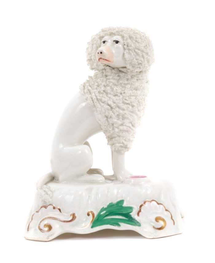 A Staffordshire porcelain inkwell, in the form of a seated poodle, circa 1840