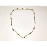 9ct gold chain interspaced with oval gold beads, 46cm long