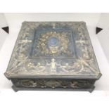 American Incolay blue stone jewellery box with relief putti and foliate scroll decoration. 24cm x 24