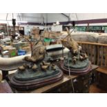 Pair of cast metal table lamps depicting a pheasant and chicks, on wooden plinths