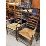 Set of six ladder back chairs with rush seats comprising four standards and two carvers
