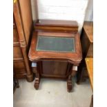 Reproduction mahogany Davenport with leather lined top, fitted interior and four drawers to each did